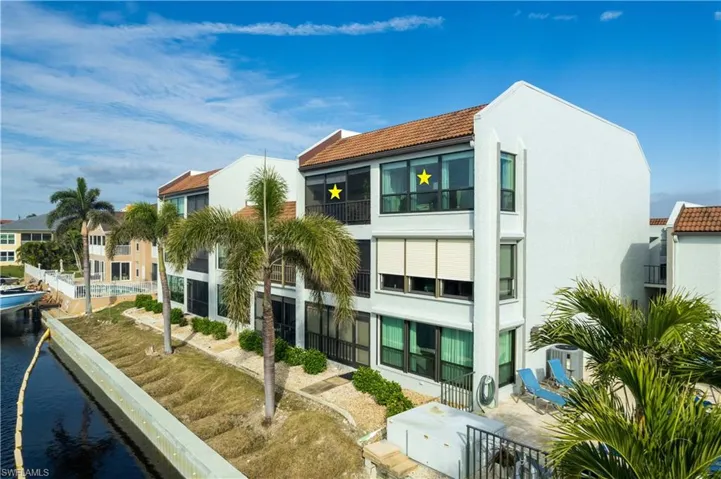 Experience direct Gulf access and stunning views of the 200+ ft wide Navarro Canal from your private balcony or sunroom in this spacious, fully furnished 2-bedroom condo