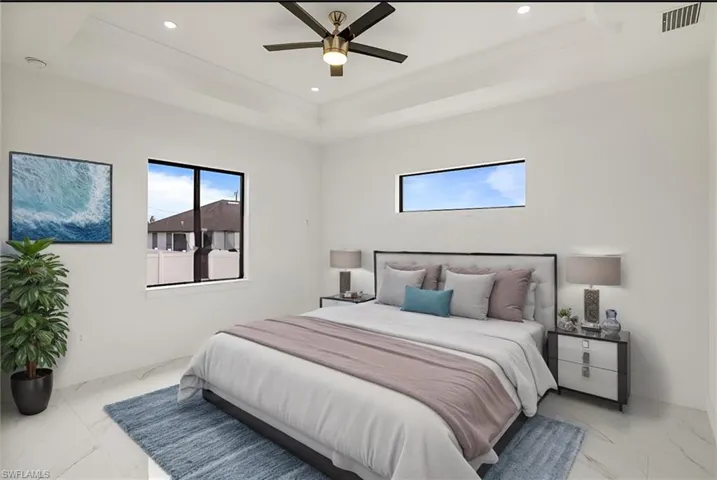 Master Bedroom with recessed lighting, a ceiling fan, visible vents, marble finish floor, and a raised ceiling
