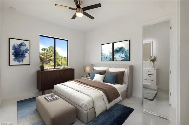 Bedroom featuring marble finish floor and ceiling fan