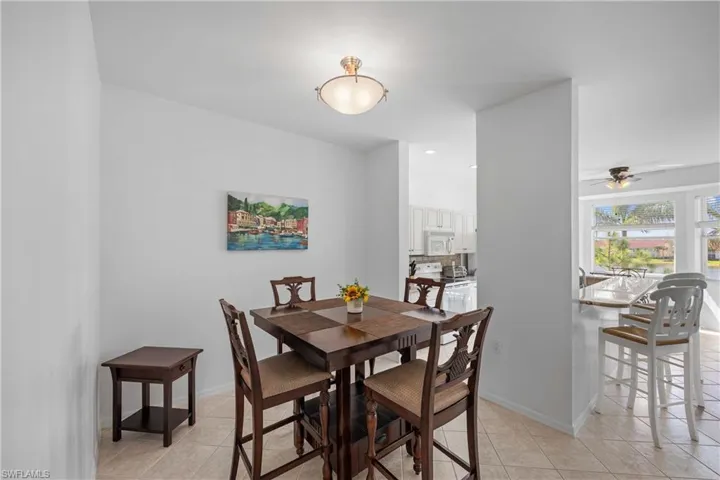 Tiled dining area with ceiling fan