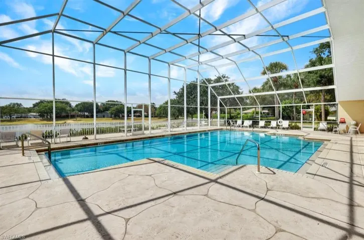 Outdoor pool with a patio area and a lanai