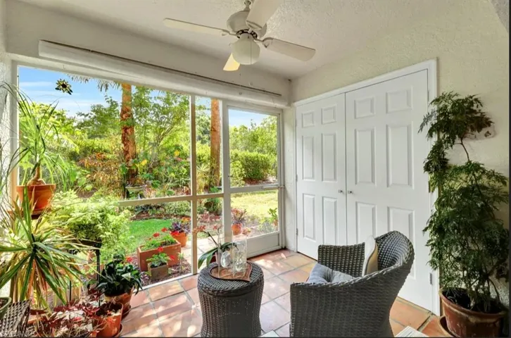 Sunroom / solarium featuring ceiling fan