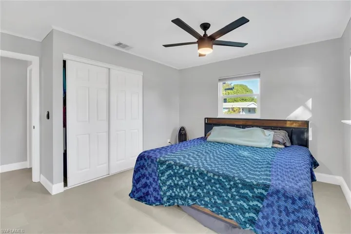 Owners Bedroom or Bedroom FOUR of FOUR featuring a closet, ceiling fan and Bathroom with Shower
