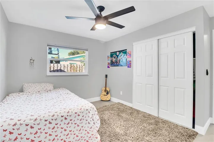 Bedroom ONE of FOUR featuring a closet and ceiling fan