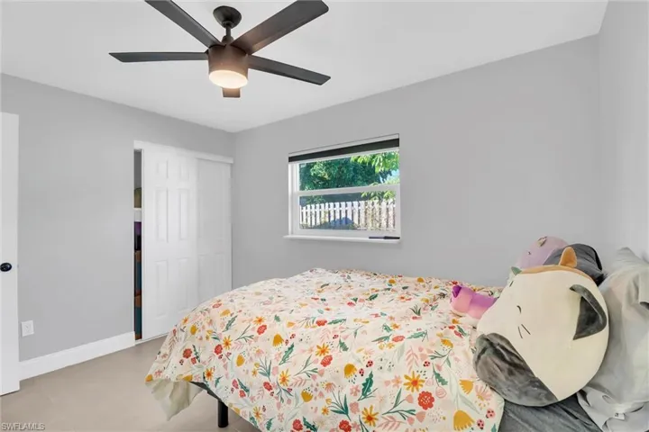 Bedroom TWO of FOUR with a closet and a ceiling fan