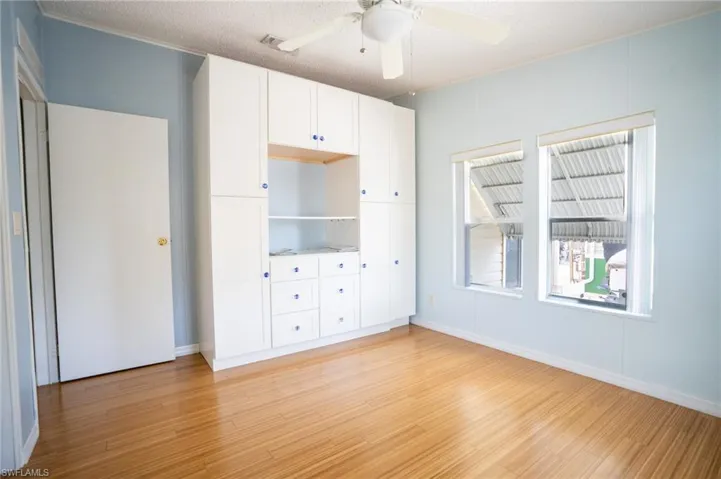 Unfurnished bedroom with light wood-type flooring and a ceiling fan
