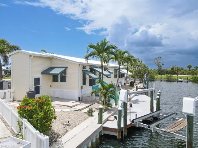 Dock with boat lift and a water view