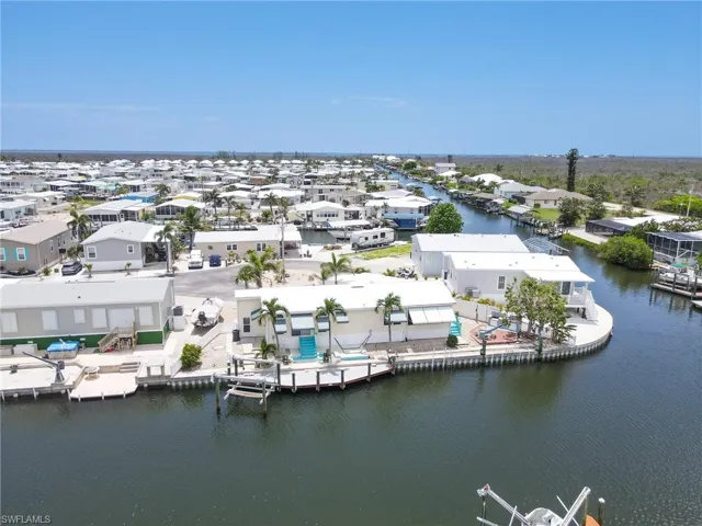 Aerial perspective of suburban area with a large body of water
