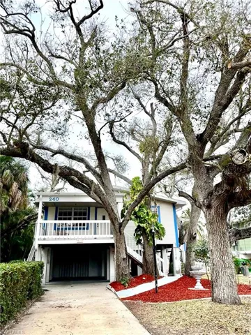Sip your drink on the front balcony porch and watch the birds. Great street full of friendly neighbors. Brick/Wood burning fireplace on ground level to sit around with your neighbors and live your best life on the water. Come view this quaint canal home.  Easy to show on Supra. One mile south of Publix.  450 steps if you want to walk over to the beautiful beach.