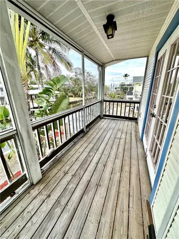 Balcony off the Master Bedroom overlooking the Gulf Access Canal, with French doors.