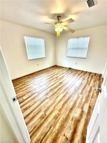 Second bedroom, newer floors and wood blinds