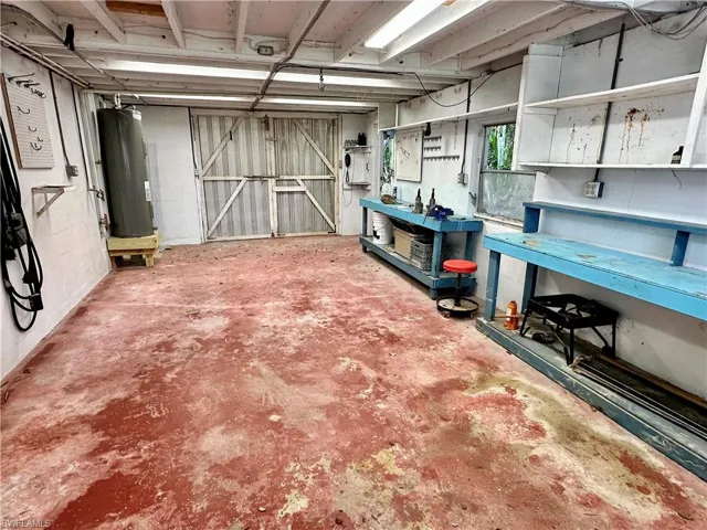 Workshop underneath the property with sliding door that open up for easy boat or jet ski launching.