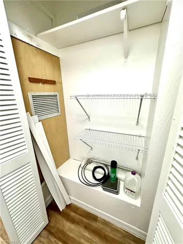 extra closet in hallway for storage with higher shelves to maximize storage