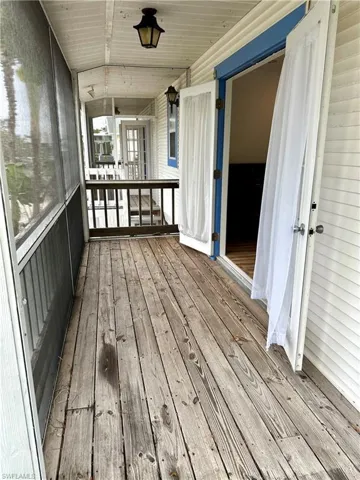 Screened in Balcony that leads from the kitchen area and overlooks the canal,