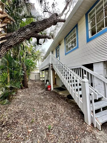Separate entrance door on the side of the home that leads to the kitchen or balcony