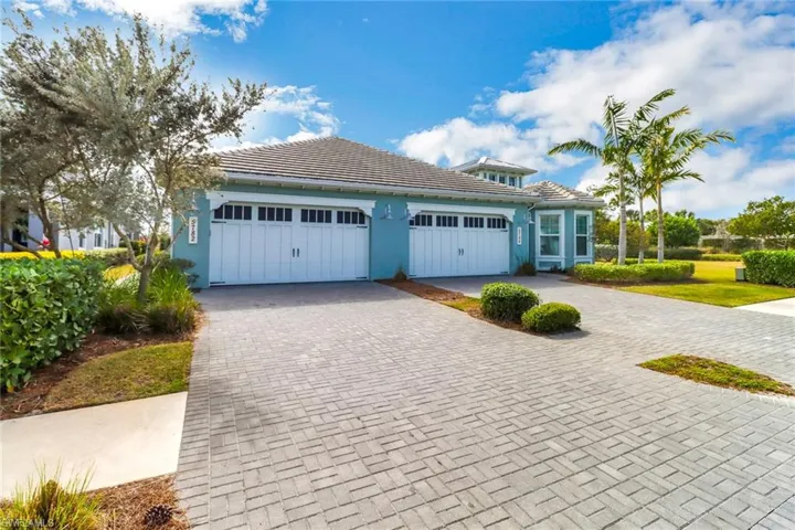 View of front facade featuring a garage