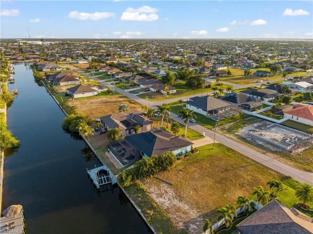 Aerial perspective of suburban area with a large body of water