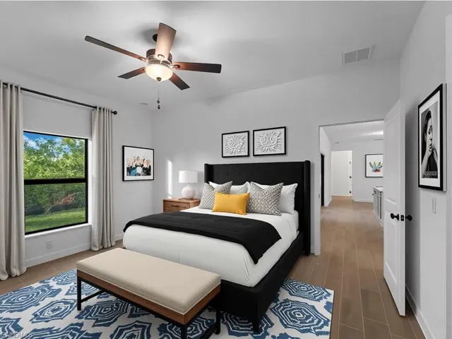 Virtually staged Bedroom featuring a ceiling fan and baseboards