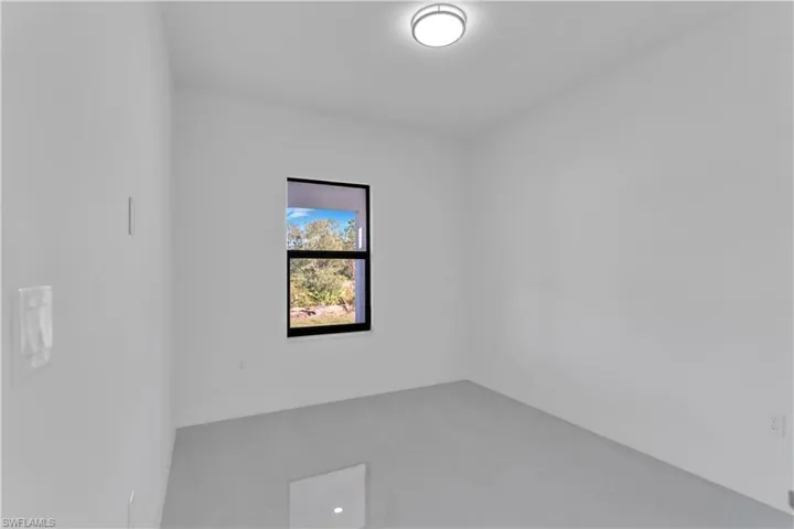 Spare room with concrete flooring