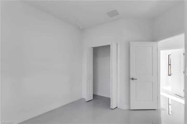 Unfurnished bedroom with a closet