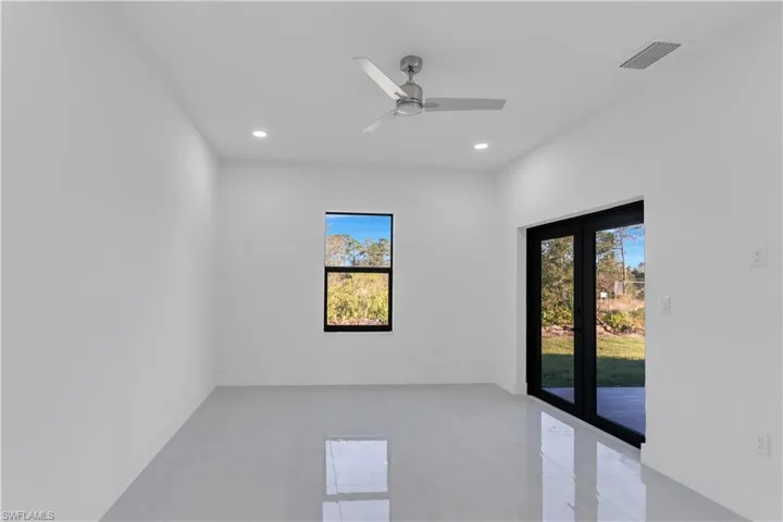 Unfurnished room featuring ceiling fan