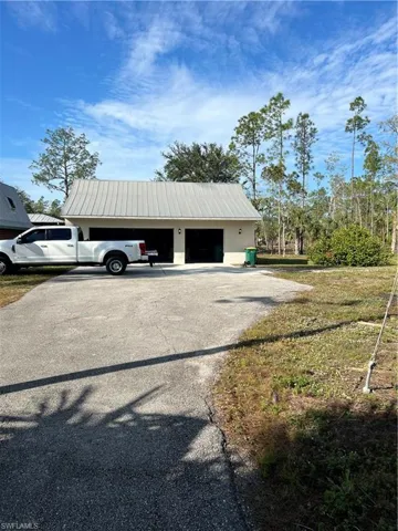 View of outdoor structure with a garage