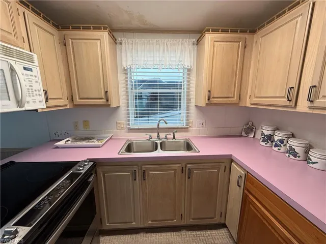 Kitchen with sink and electric stove