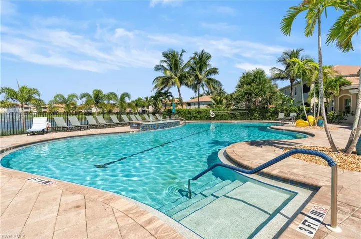 Community pool featuring a patio area
