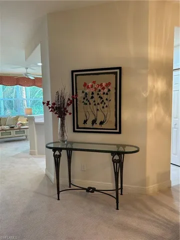 Interior details featuring carpet floors and ceiling fan