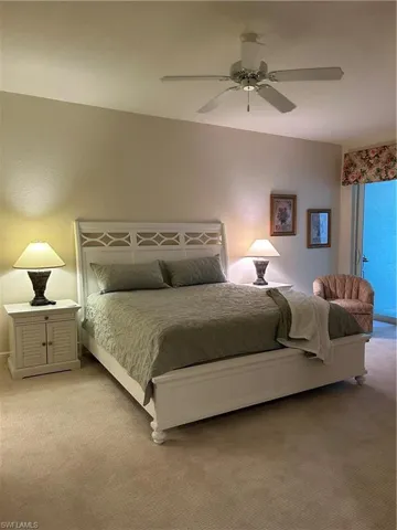 Bedroom featuring access to outside, carpet floors, and ceiling fan