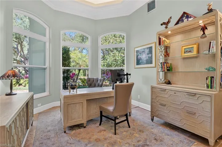 Office with ornamental molding and baseboards