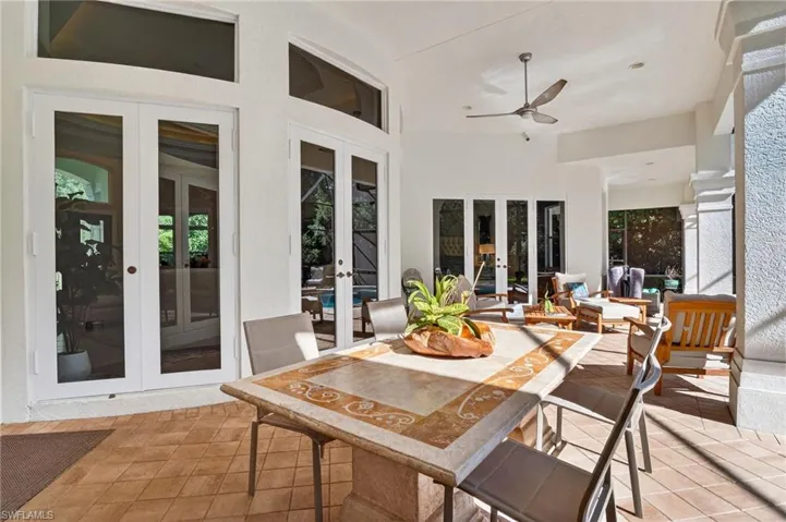 Sunroom / solarium featuring french doors