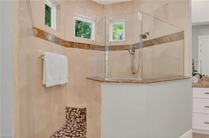 Bathroom with a walk in shower and vanity