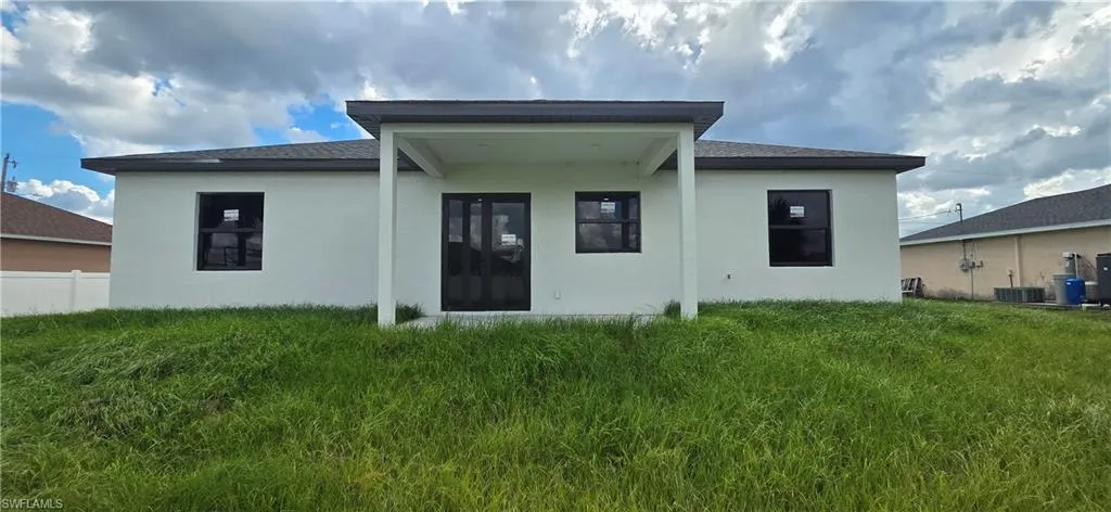 Back of house with stucco siding