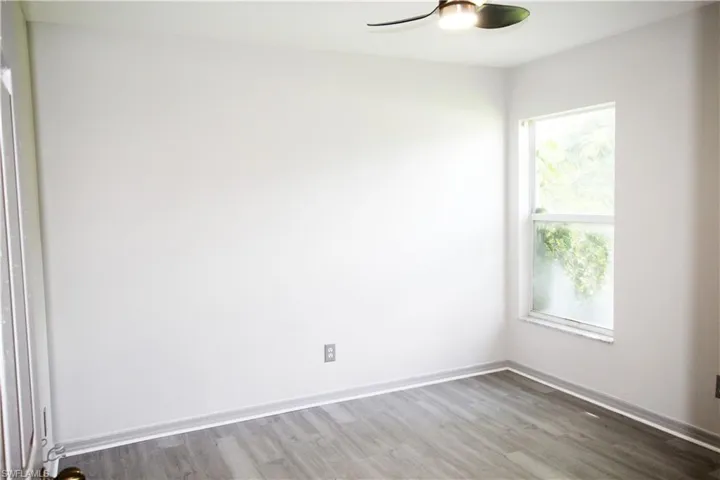 Empty room with wood-type flooring