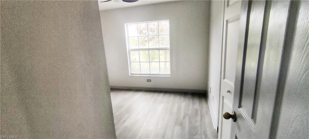 Unfurnished sunroom featuring a wealth of natural light