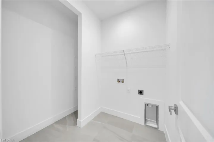 Laundry area with washer hookup and electric dryer hookup