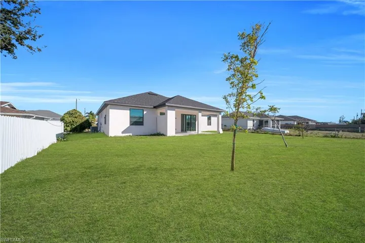 Back of house with stucco siding
