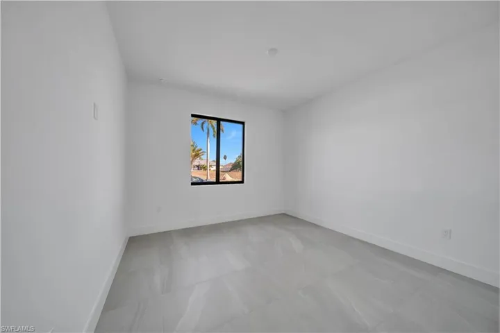 Unfurnished room with baseboards