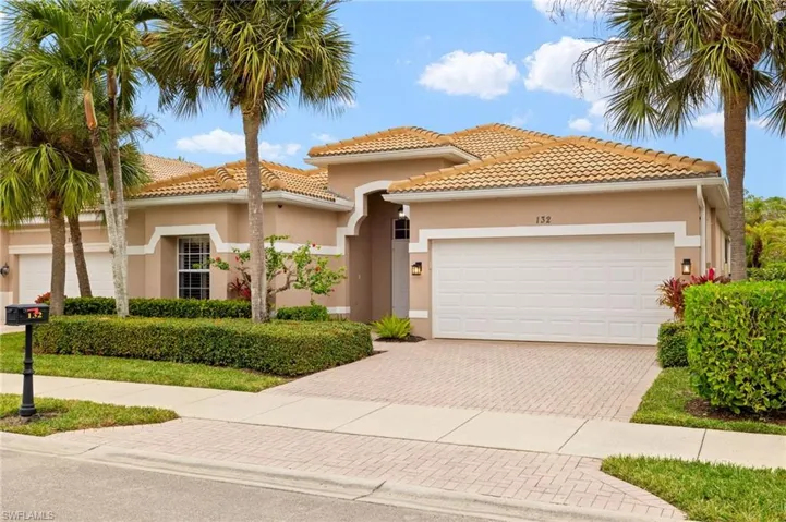 Mediterranean / spanish-style house featuring a garage
