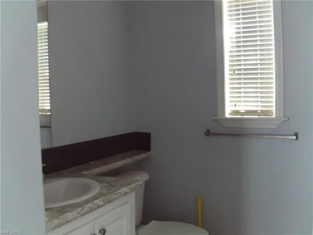 Bathroom with toilet and vanity