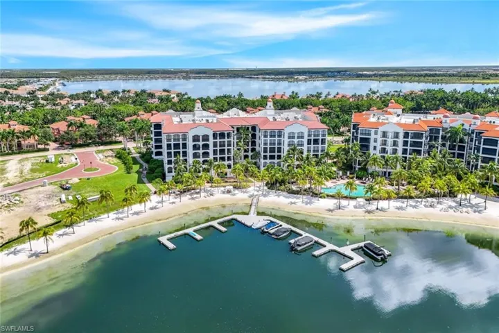 Bird's eye view of Mirasol from the water. This home is 5th floor corner unit left side of building. Miromar's largest lake in backround.