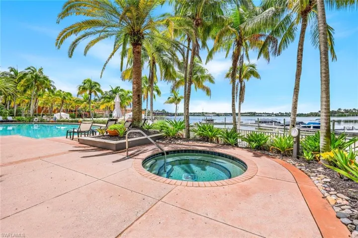 Private Mirasol beachfront swimming pool with a patio area, hot tub private cabannas and 2 gas grills and dining tables