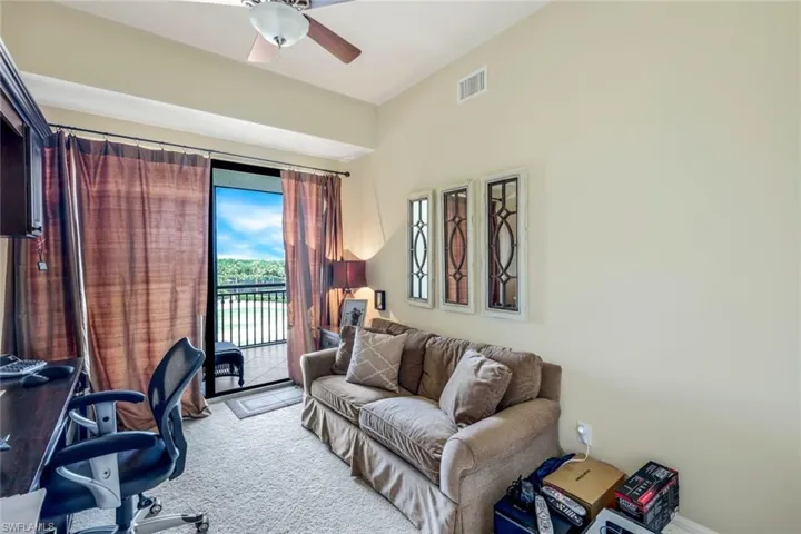 Office/Den with private screened lanai and wall of built in desks and cabinets.
