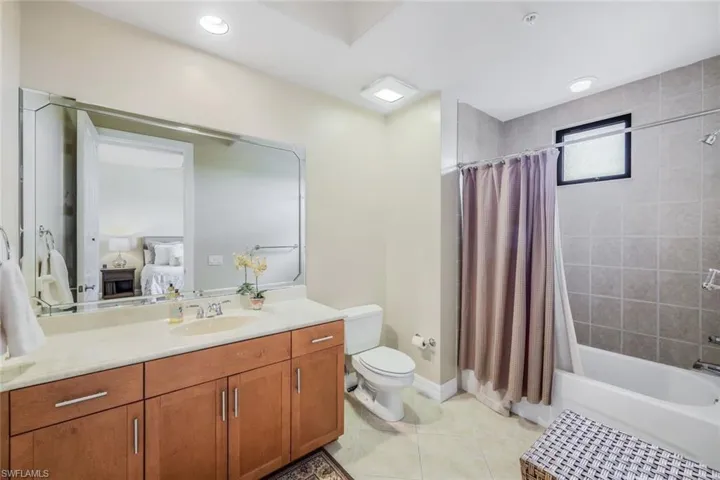 3rd bedroom ensuite Full bathroom with vanity,  shower / bath combo.