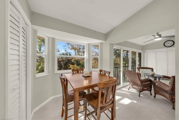 Sunroom / solarium featuring lofted ceiling and plenty of natural light