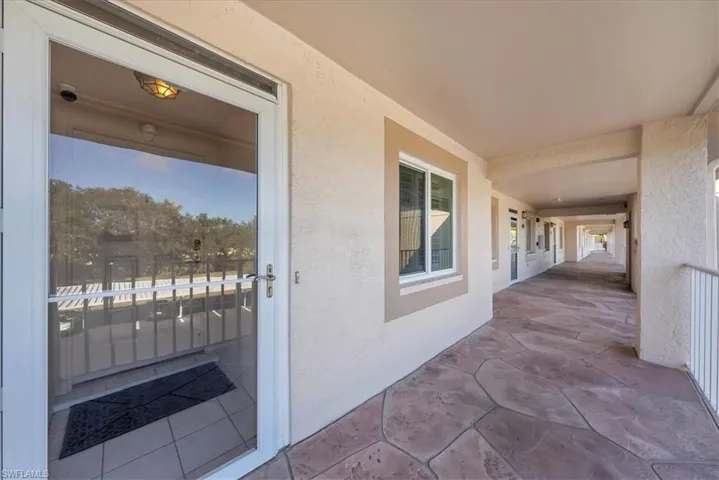 View of exterior entry with stucco siding