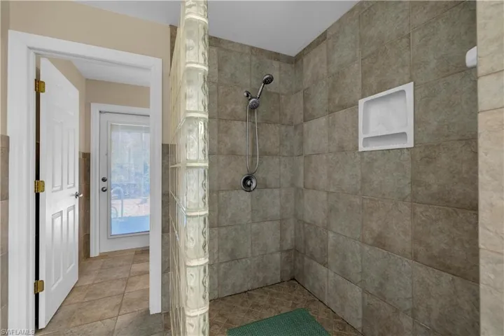 Bathroom featuring a tile shower