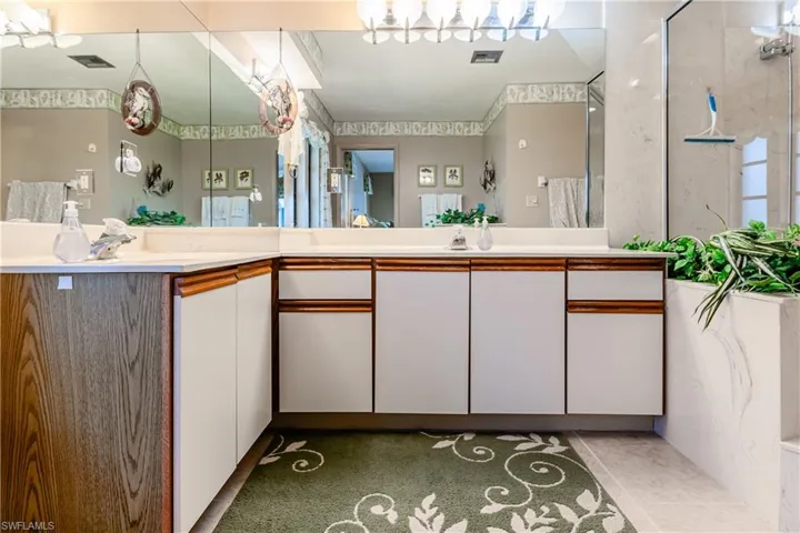 Bathroom with vanity and a shower