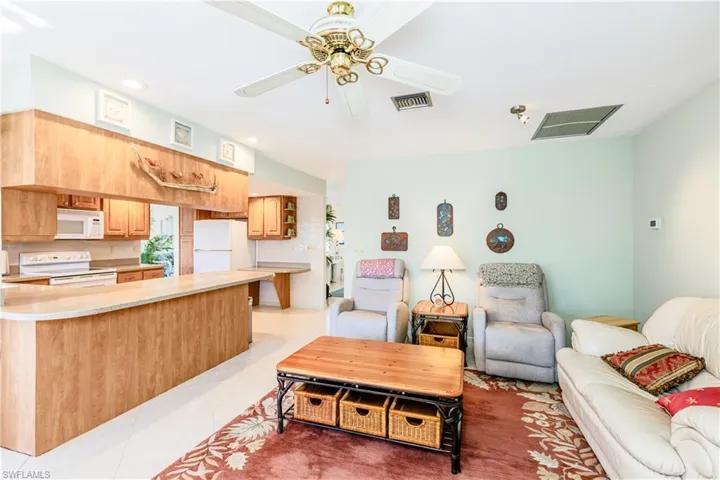 Tiled living room with ceiling fan